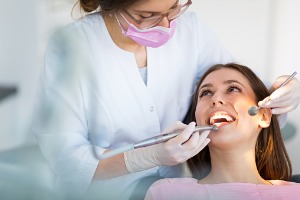 Woman getting her teeth checked by the Best Dentist in Bloomington IL